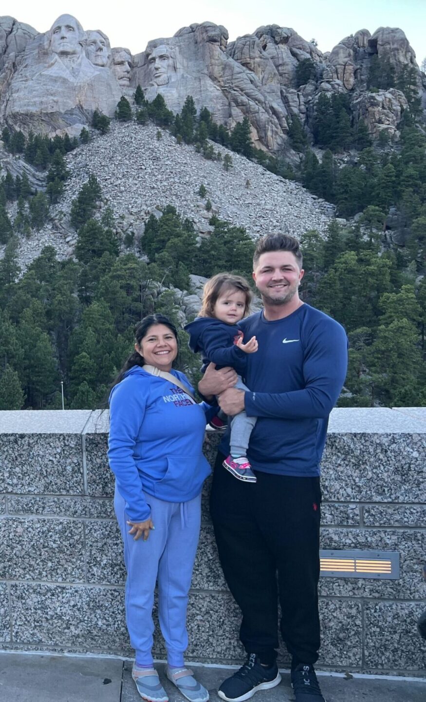 Dr. Hansen with wife Fatima and daughter Grace in front of Mount Rushmore
