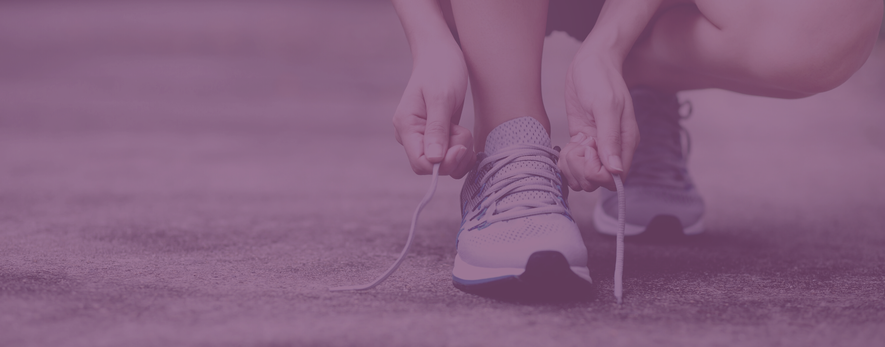 person tying their sneakers