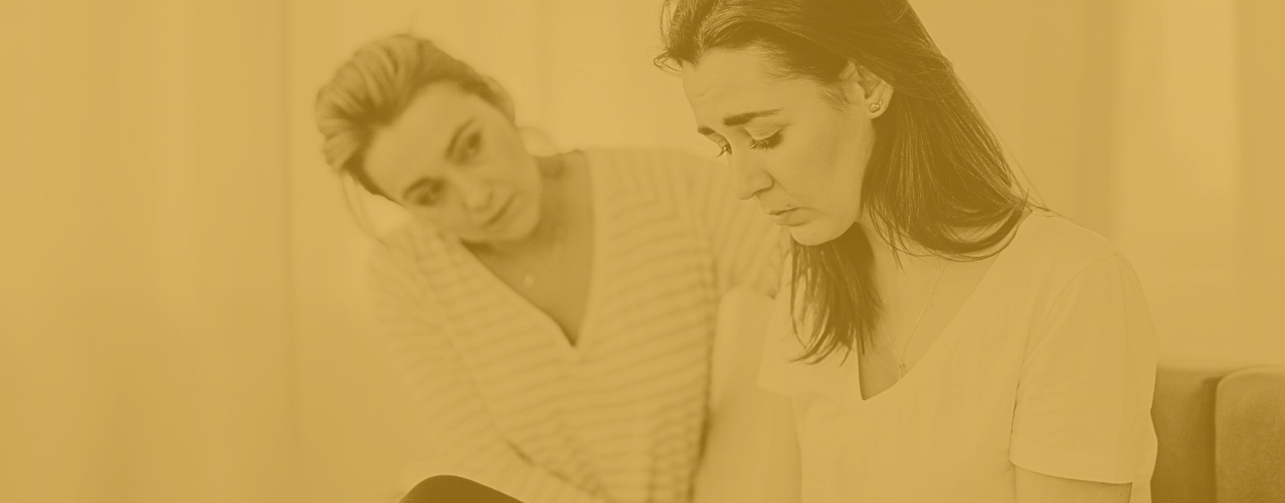 concerned woman comforting sad woman